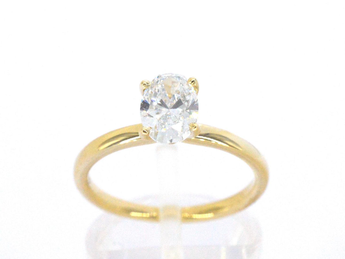 Gouden solitair ring met een ovaal van 1.00 carat