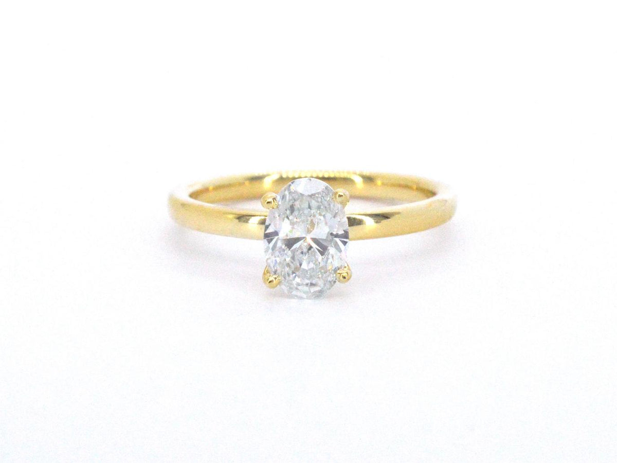 Gouden solitair ring met een ovaal van 1.00 carat